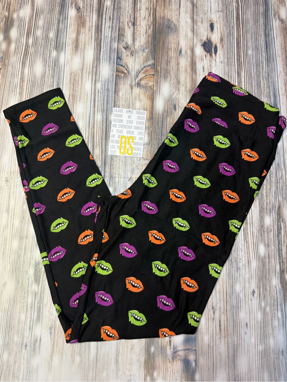 LuLaRoe Black Leggings with Green, Orange & Purple Lip Print